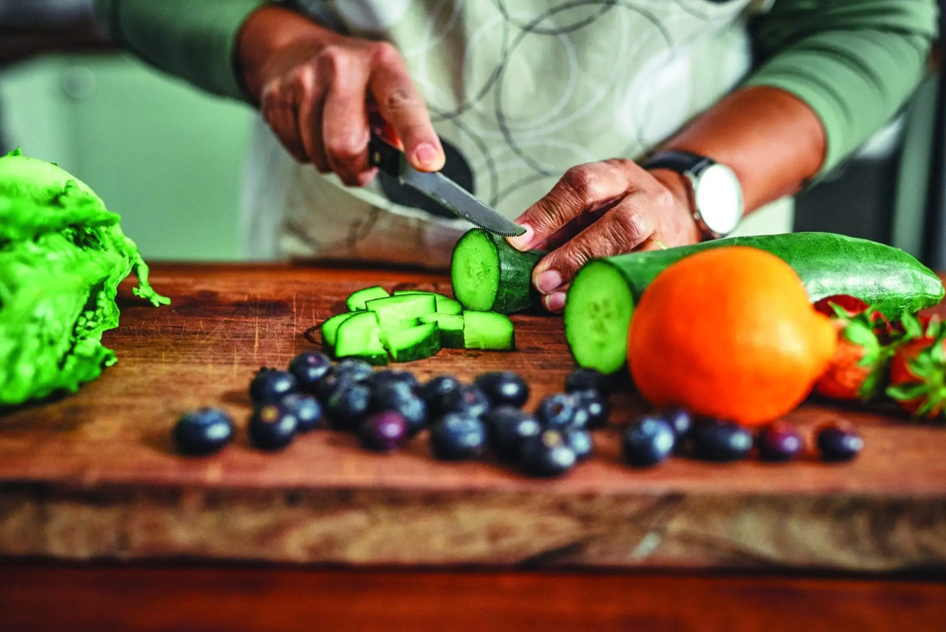 Person chopping vegetables on a cutting board